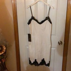 Textured white dress with black lace trim